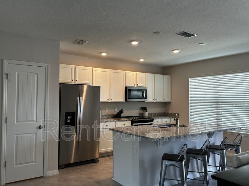 Resort Style Living! Stunning 3/2.5 Townhome in Waterleigh! Available April! property image
